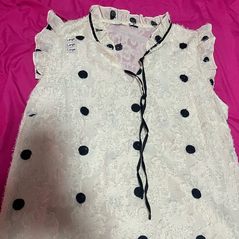 White blouse with black polka dots